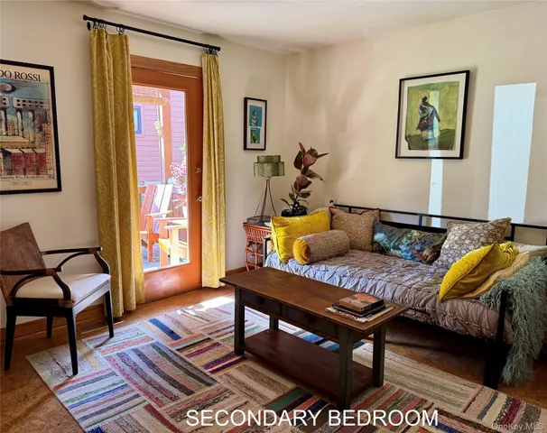 a living room with a couch and a window