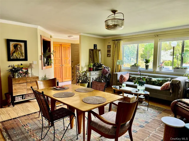 a view of a dining room with furniture window and outside view