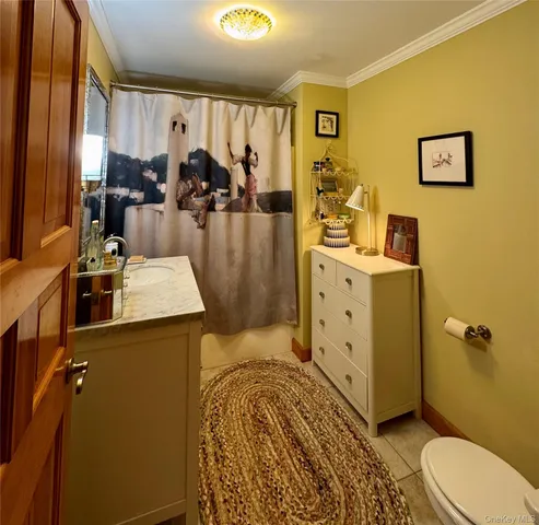 a bathroom with a sink a mirror and shower