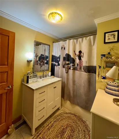 a picture of a bathroom with a sink and a mirror