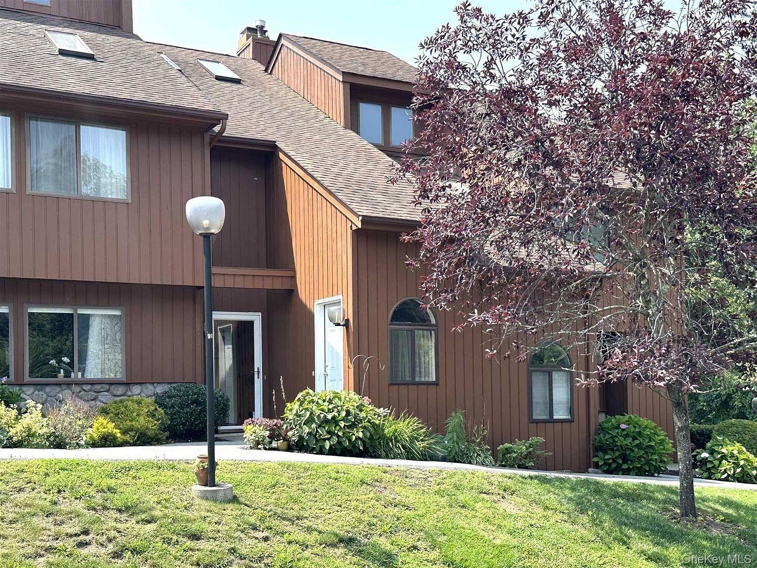172 Swan Lane Poughkeepsie, NY 12603 - Photo 28 of 48 a front view of a house with garden
