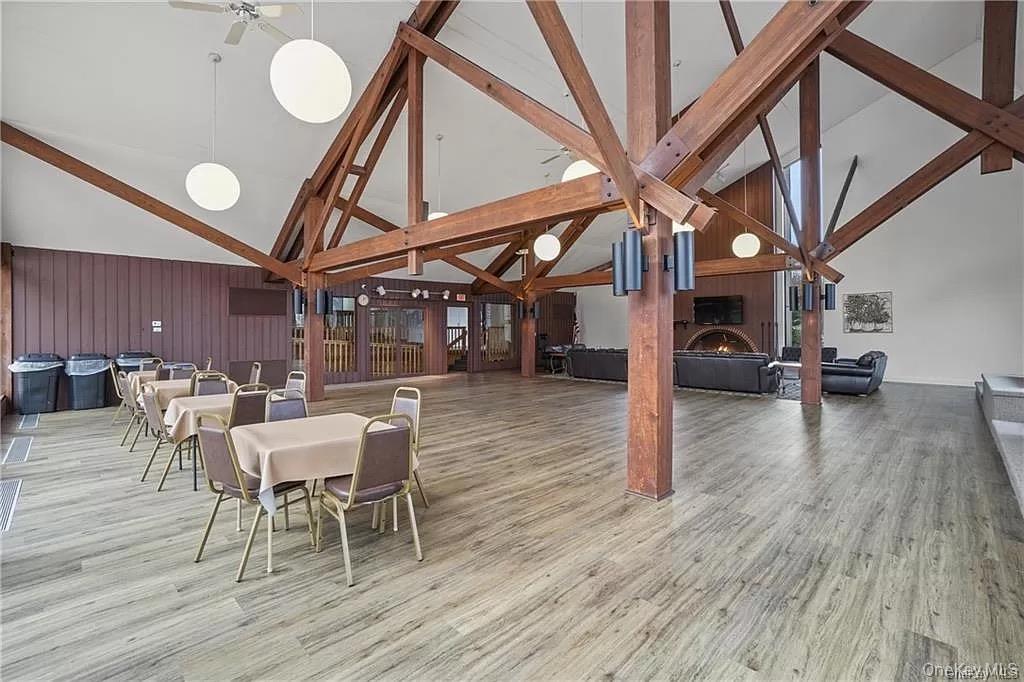 172 Swan Lane Poughkeepsie, NY 12603 - Photo 40 of 48 a view of a dining room with furniture and wooden floor