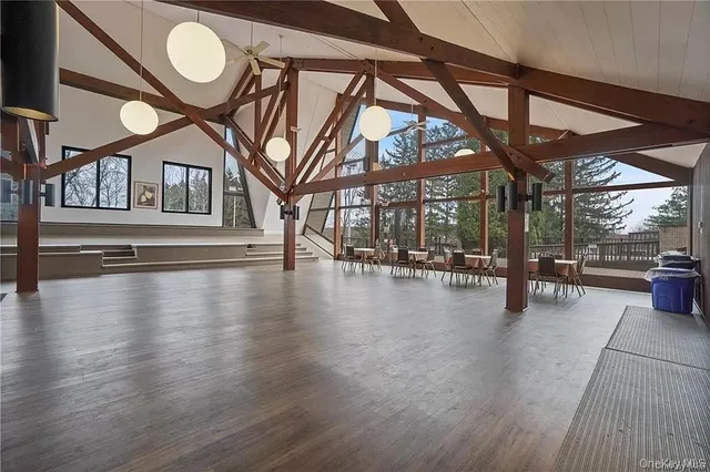 a view of a hall with wooden floor