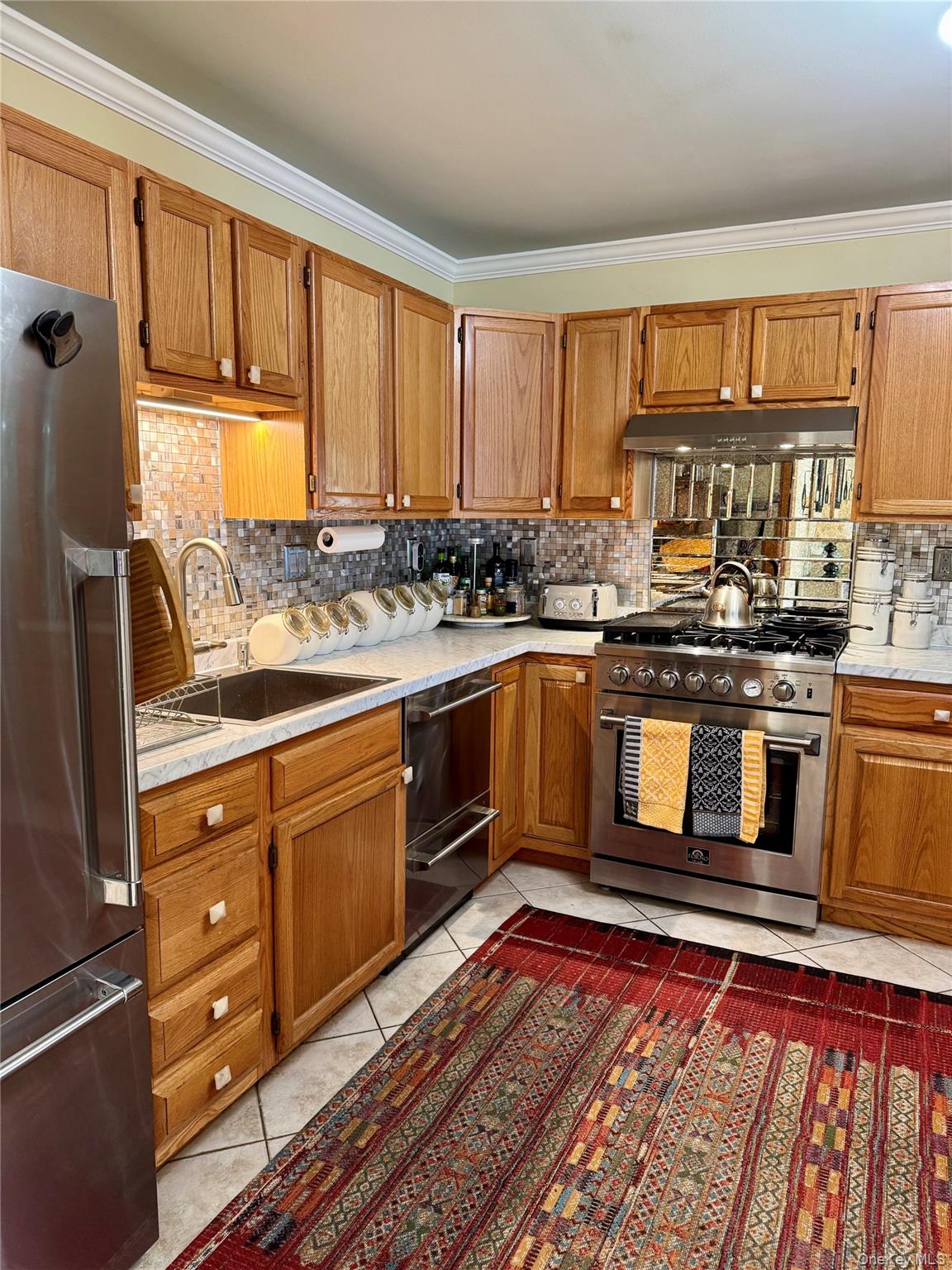 172 Swan Lane Poughkeepsie, NY 12603 - Photo 7 of 48 a kitchen with stainless steel appliances granite countertop a stove sink and cabinets