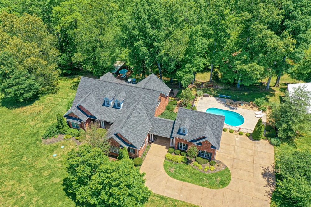 7880 Pinewood Road Fairview, TN 37062 - Photo 1 of 46 an aerial view of a house with yard swimming pool and outdoor seating