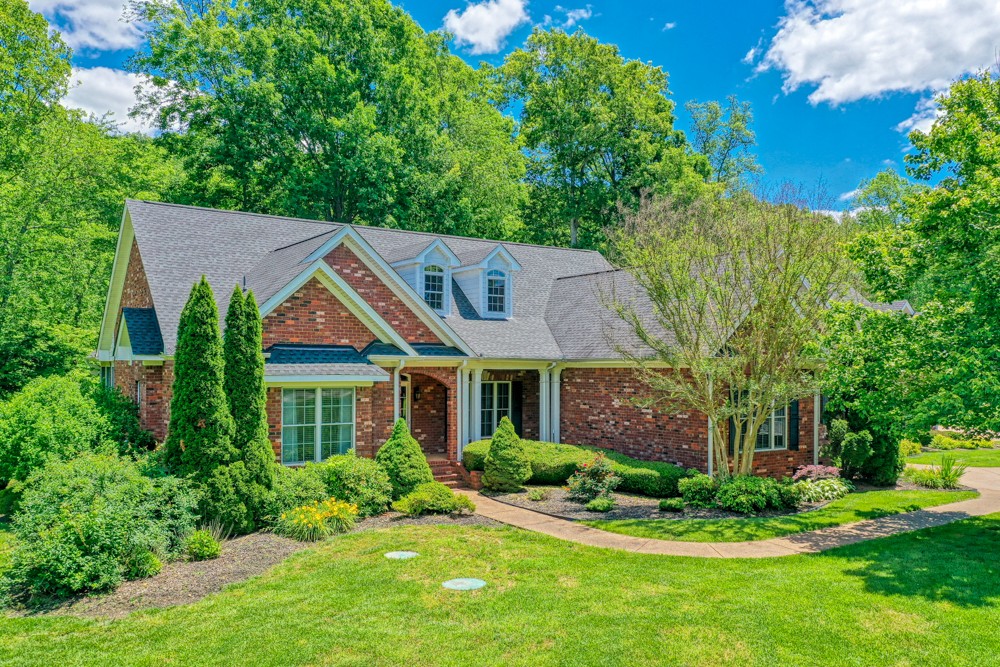 7880 Pinewood Road Fairview, TN 37062 - Photo 2 of 46 a front view of a house with a yard