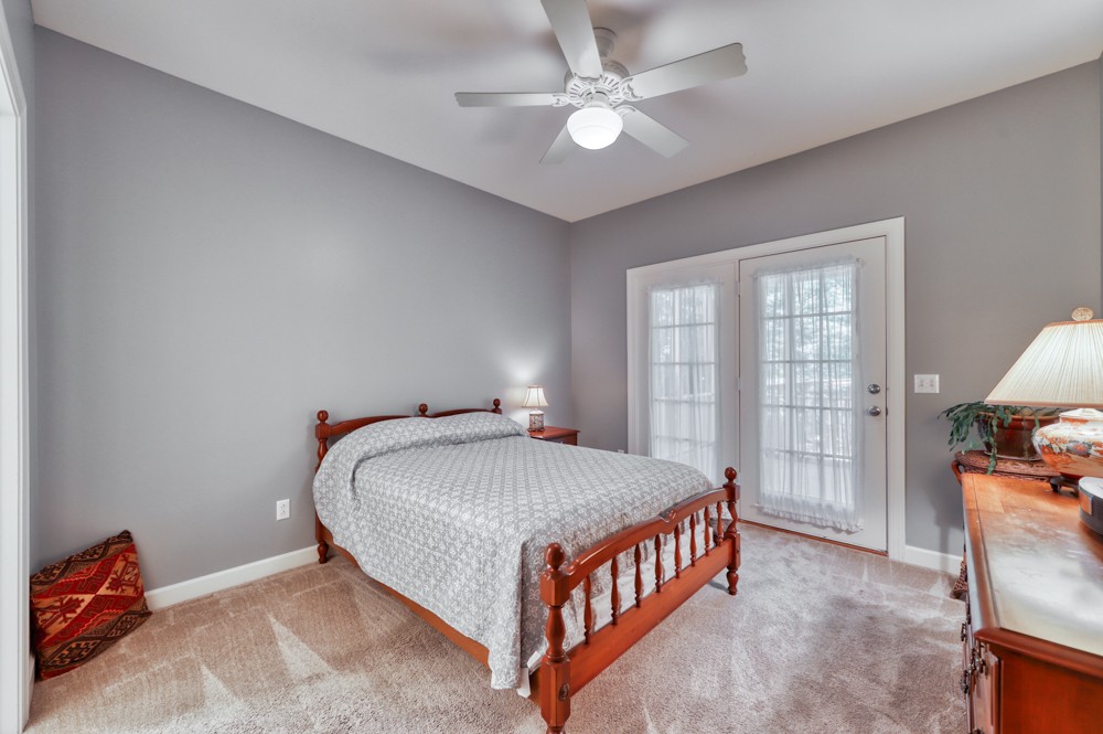 7880 Pinewood Road Fairview, TN 37062 - Photo 24 of 46 a bed sitting in a bedroom next to a window
