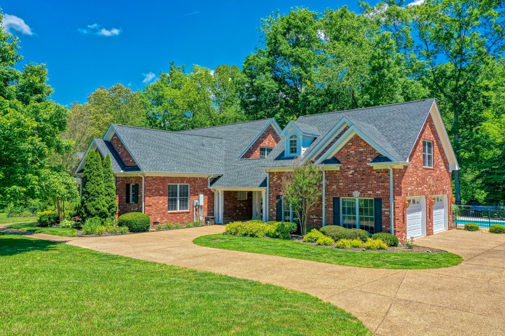 7880 Pinewood Road Fairview, TN 37062 - Photo 3 of 46 a front view of a house with a yard