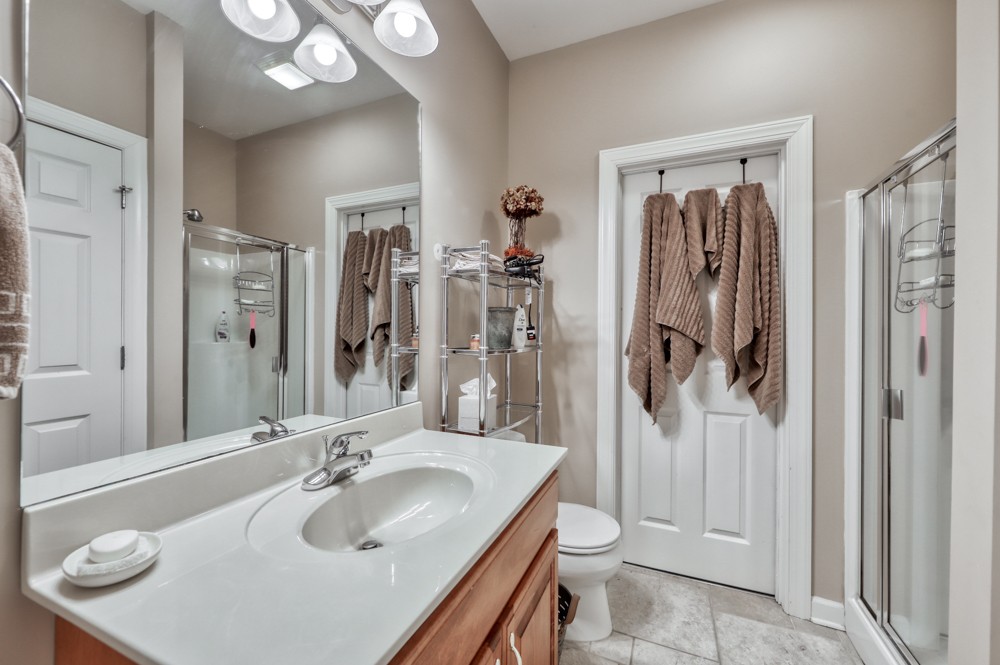 7880 Pinewood Road Fairview, TN 37062 - Photo 31 of 46 a bathroom with a sink a toilet and shower
