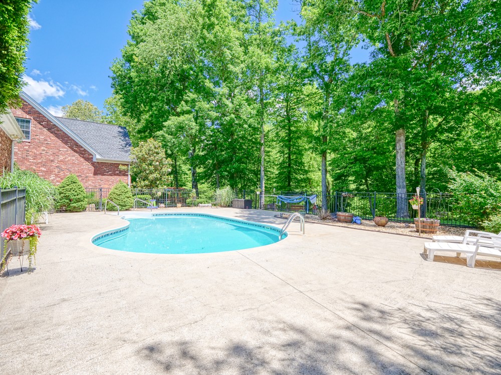 7880 Pinewood Road Fairview, TN 37062 - Photo 36 of 46 a view of a swimming pool and a yard
