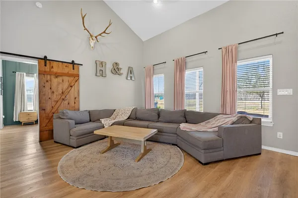 a living room with furniture and a large window