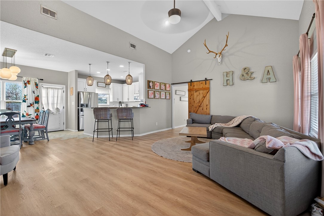 20401 County Road 1740 Mathis, TX 78368 - Photo 12 of 35 a living room with furniture and wooden floor