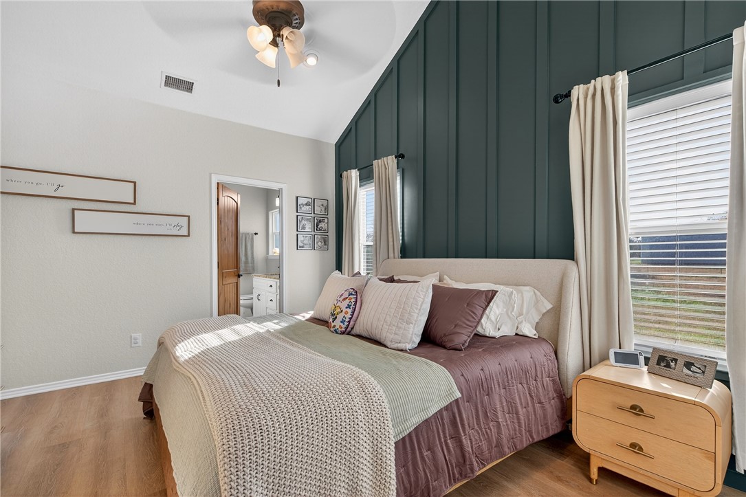 20401 County Road 1740 Mathis, TX 78368 - Photo 14 of 35 a bedroom with a bed dresser and a window