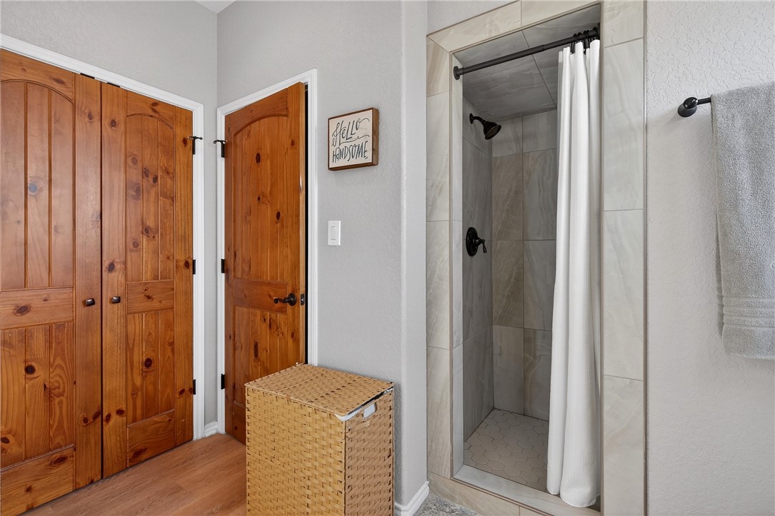 20401 County Road 1740 Mathis, TX 78368 - Photo 16 of 35 a view of a bathroom from a hallway