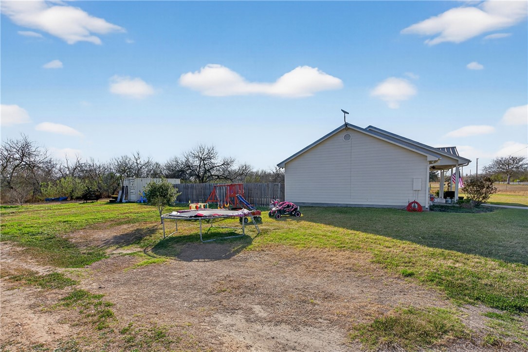 20401 County Road 1740 Mathis, TX 78368 - Photo 32 of 35 a view of a house with backyard and sitting area