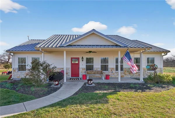 front view of a house with swimming pool