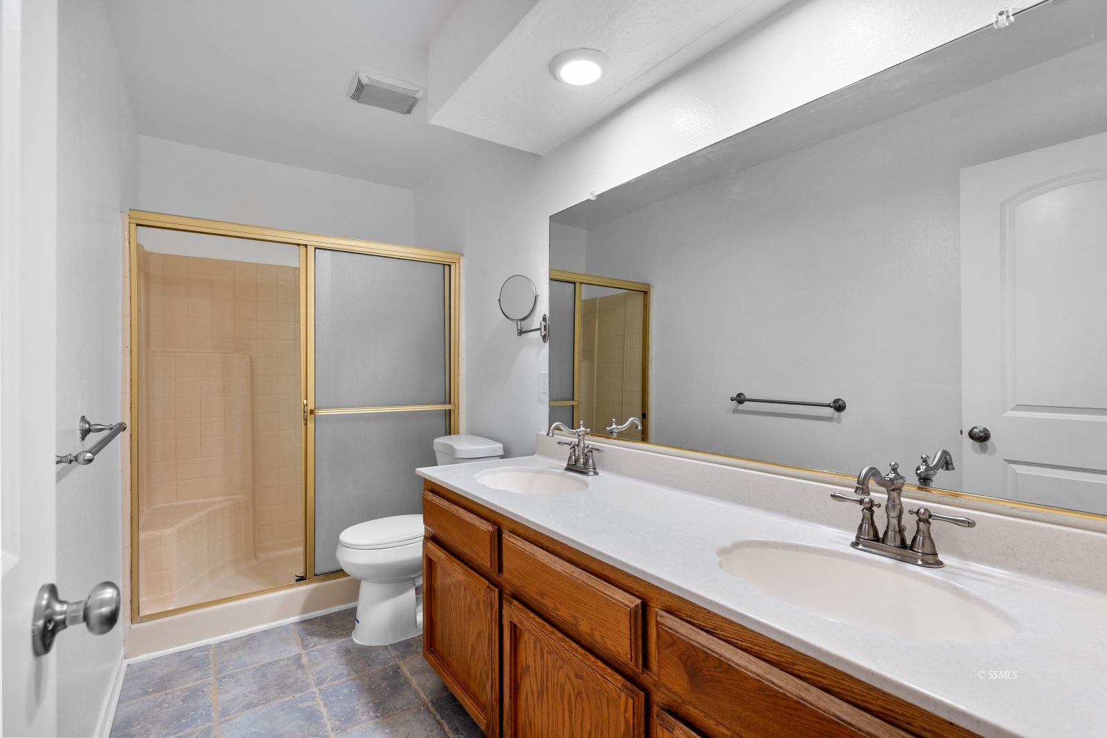 833 Charles Court Ridgecrest, CA 93555 - Photo 16 of 30 a bathroom with a double vanity sink toilet and shower