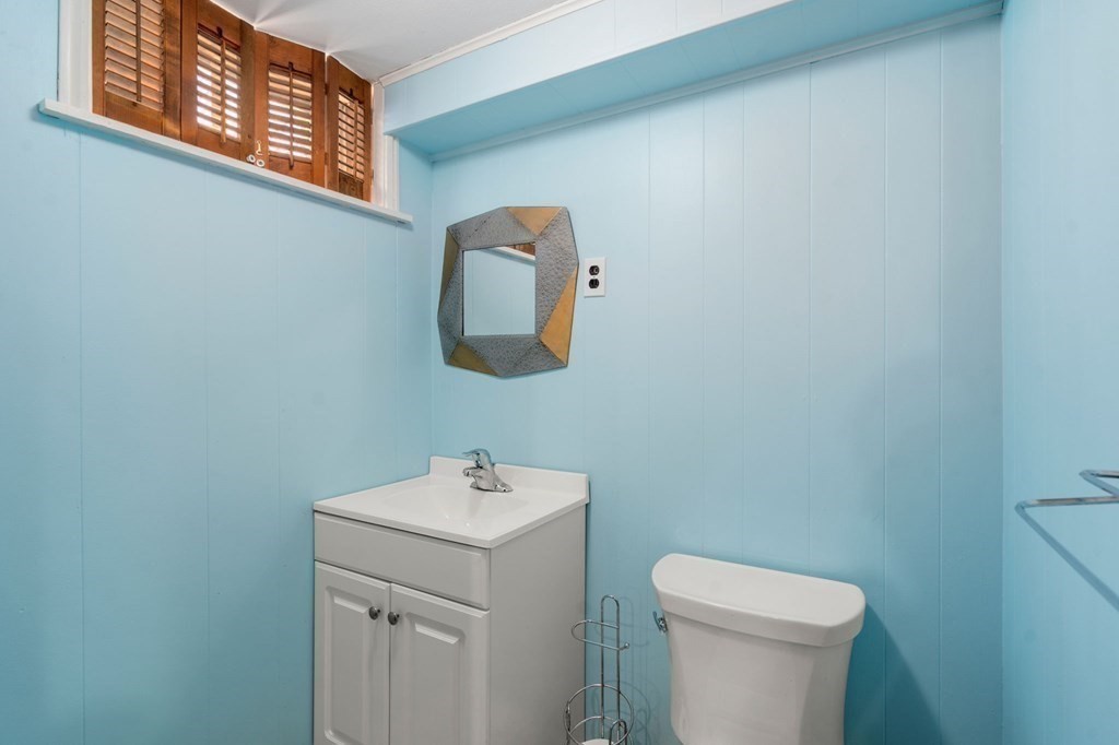 32 Eaton Road Framingham, MA 01701 - Photo 22 of 30 a bathroom with a toilet sink and mirror