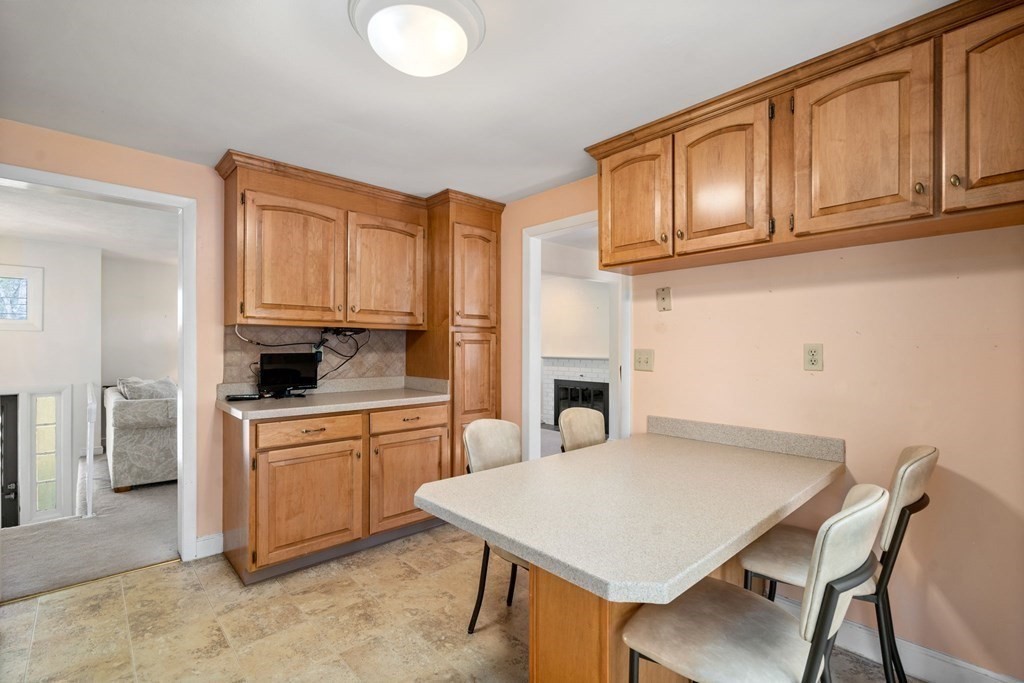 32 Eaton Road Framingham, MA 01701 - Photo 4 of 30 a kitchen with stainless steel appliances granite countertop a white cabinets a stove top oven a sink and dishwasher