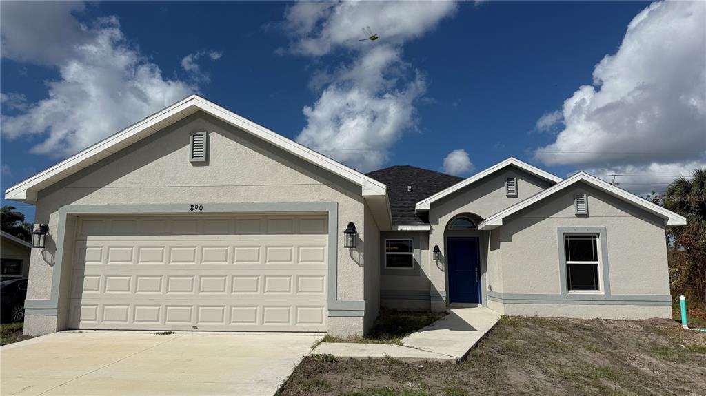 890 Indus Road Venice, FL 34293 - Photo 1 of 1 a front view of a house with a yard