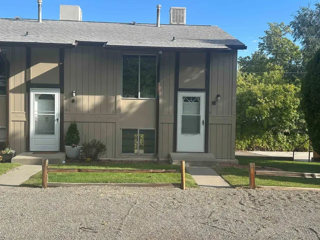 a house with trees in the background