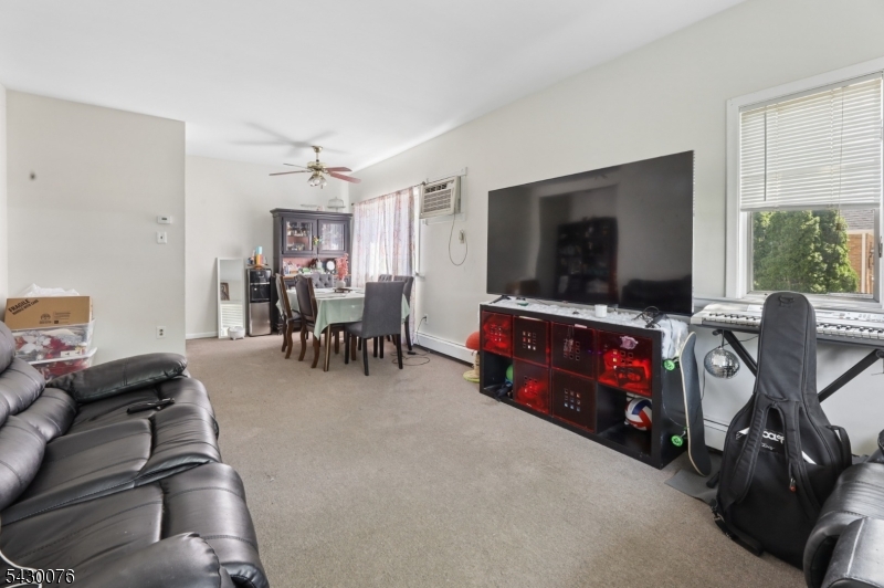 360 Rutherford Boulevard Clifton, NJ 07014 - Photo 20 of 42 a view of a livingroom with furniture and a flat screen tv