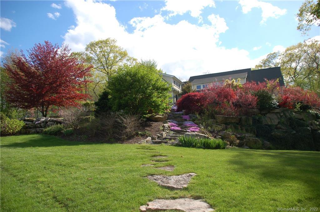 Stone walk-way lined with perennials.