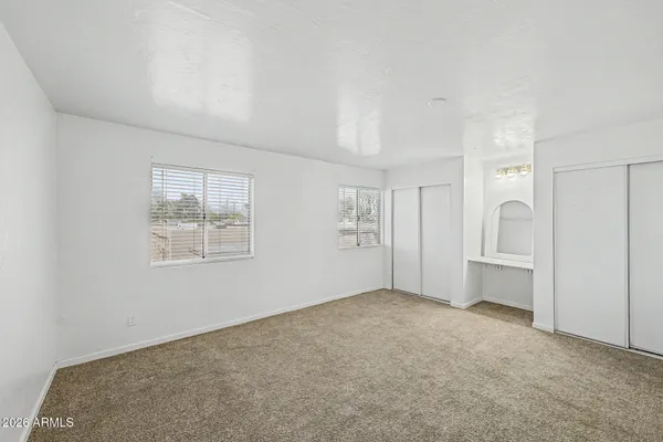 an empty room with windows