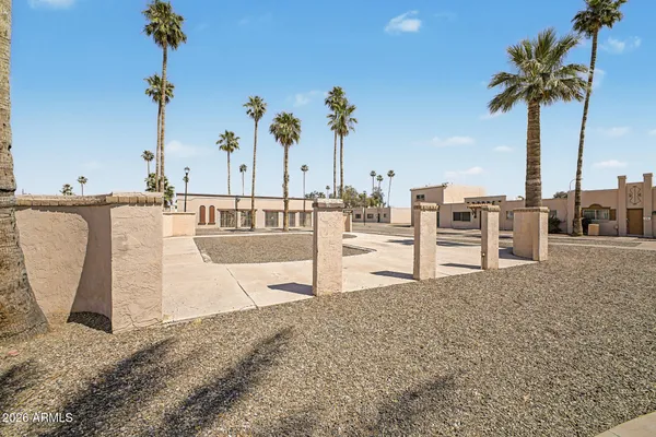 a view of a swimming pool with a table and chairs