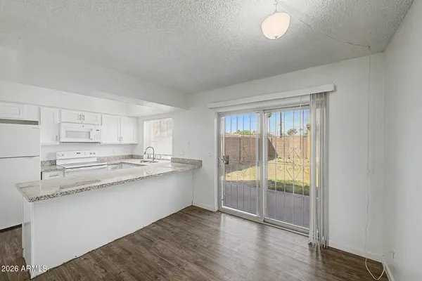 a kitchen with stainless steel appliances granite countertop a stove and a sink