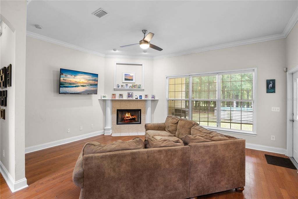 21737 Old Providence Road Alachua, FL 32615 - Photo 12 of 29 a living room with furniture large window and fireplace