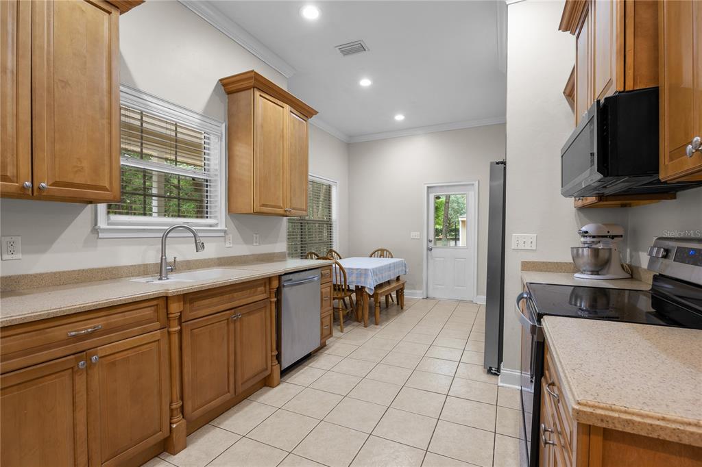 21737 Old Providence Road Alachua, FL 32615 - Photo 15 of 29 a kitchen with a sink cabinets and window