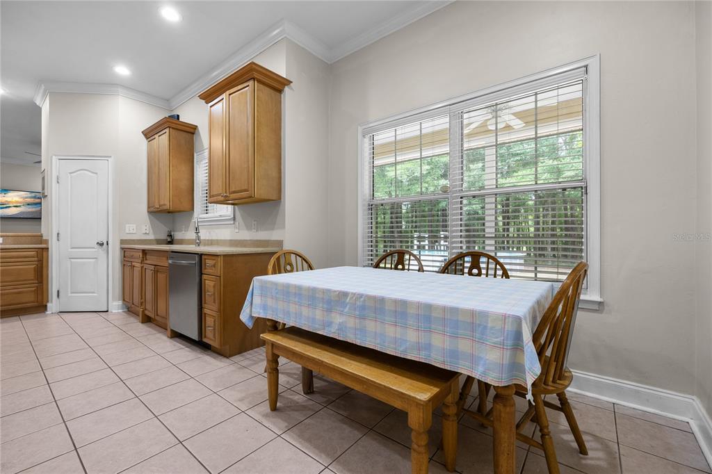 21737 Old Providence Road Alachua, FL 32615 - Photo 16 of 29 a dining room with a window table and chairs