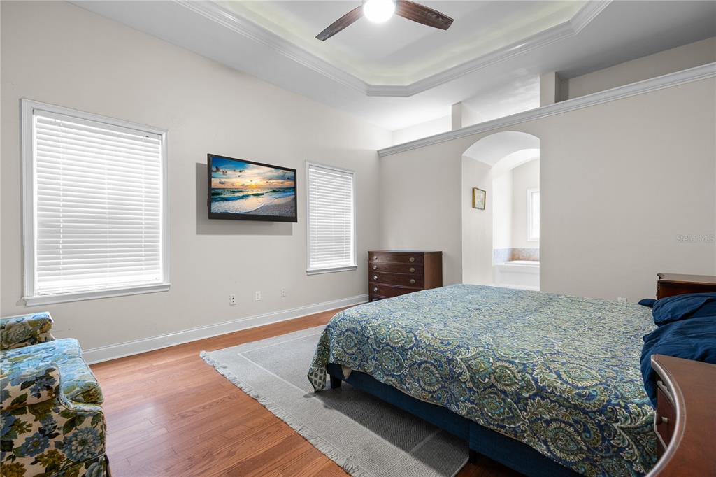 21737 Old Providence Road Alachua, FL 32615 - Photo 17 of 29 a bedroom with a bed and a tv