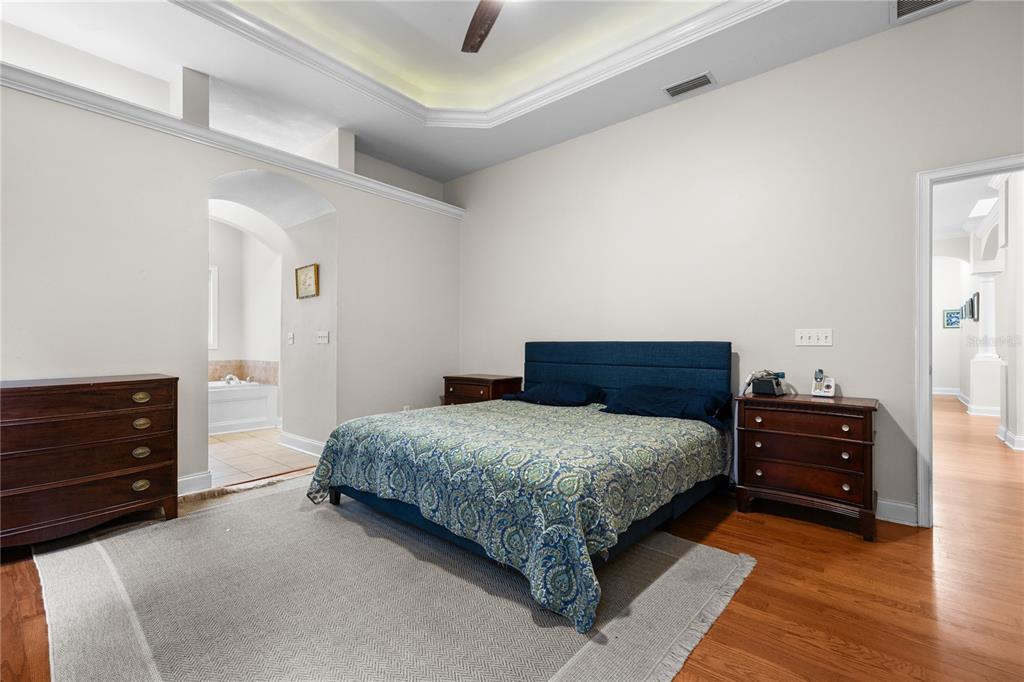 21737 Old Providence Road Alachua, FL 32615 - Photo 18 of 29 a bedroom with a bed and a dresser