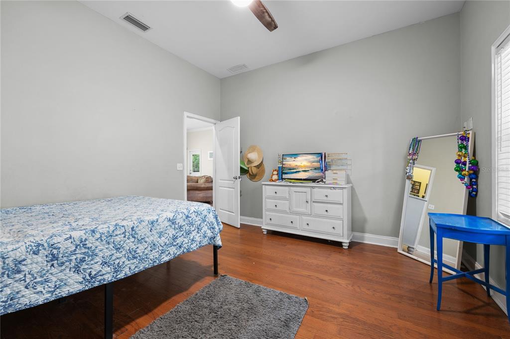 21737 Old Providence Road Alachua, FL 32615 - Photo 21 of 29 a bedroom with a bed and a chair in it