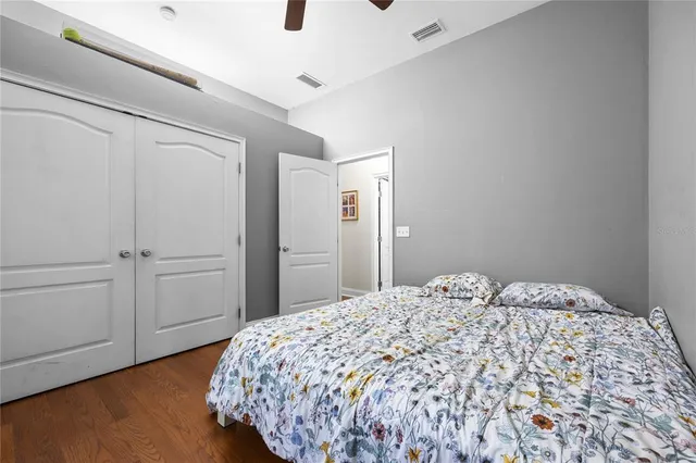 a bedroom with a bed and a dresser