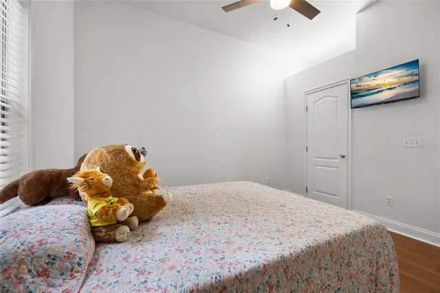 a bedroom with a bed and a baby crib