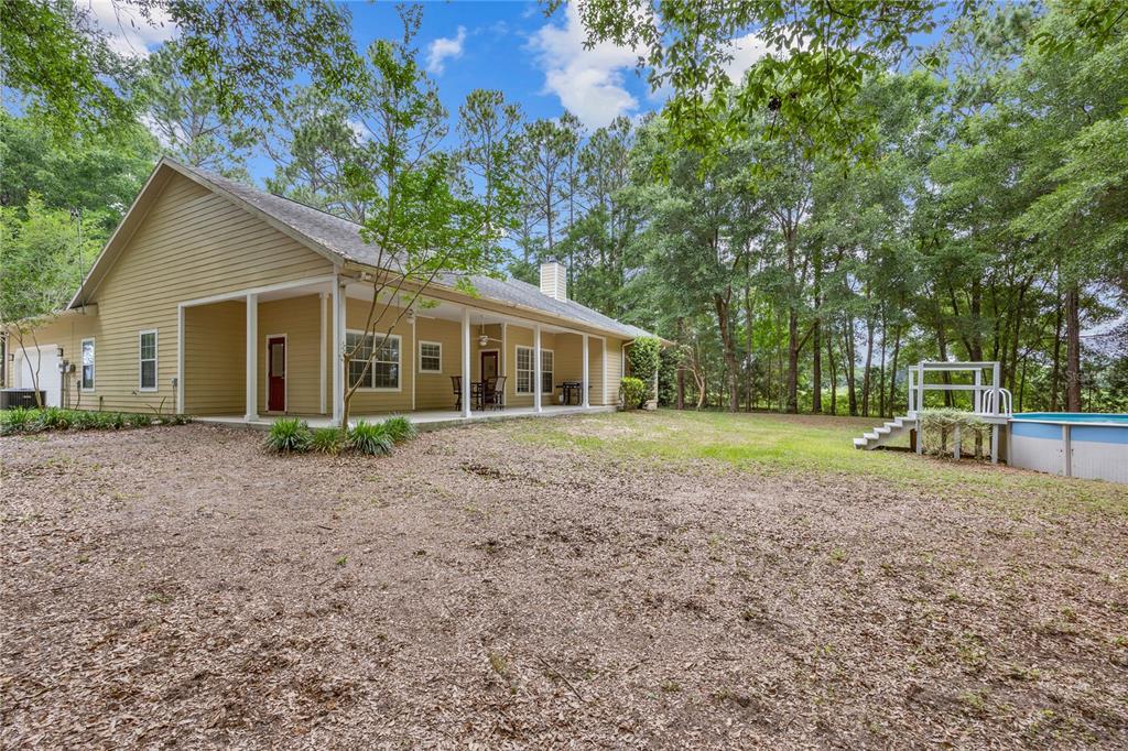 21737 Old Providence Road Alachua, FL 32615 - Photo 4 of 29 a view of a house with a backyard