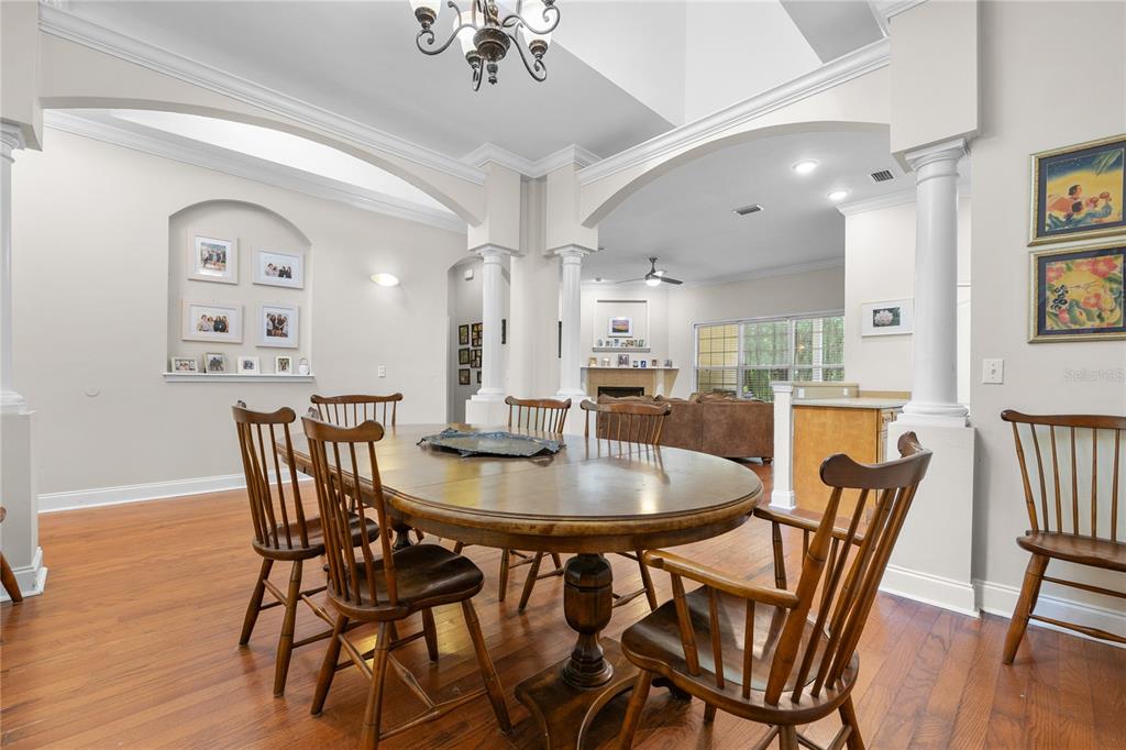 21737 Old Providence Road Alachua, FL 32615 - Photo 9 of 29 a view of a dining room with furniture and wooden floor