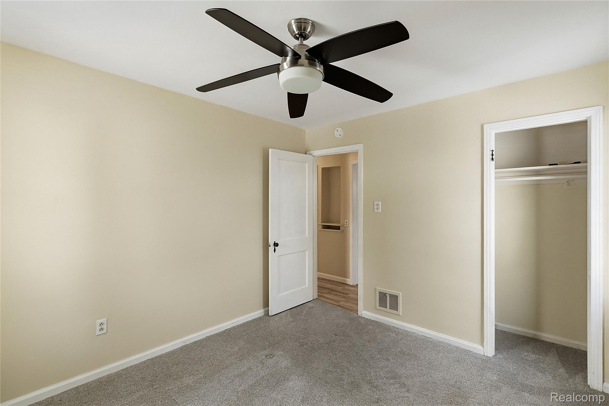 26104 Student Street Redford, MI 48239 - Photo 16 of 30 Unfurnished bedroom with carpet floors, a closet, and ceiling fan