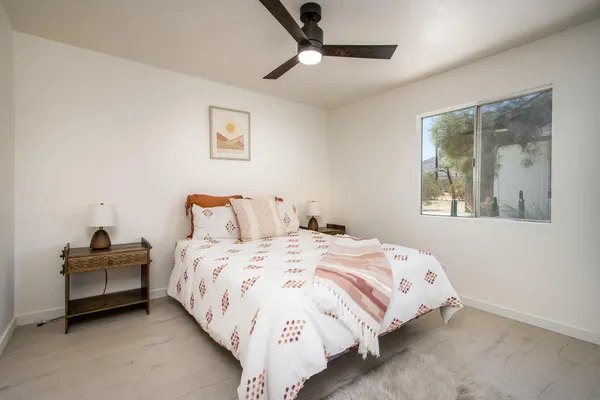 a bedroom with bed and a window