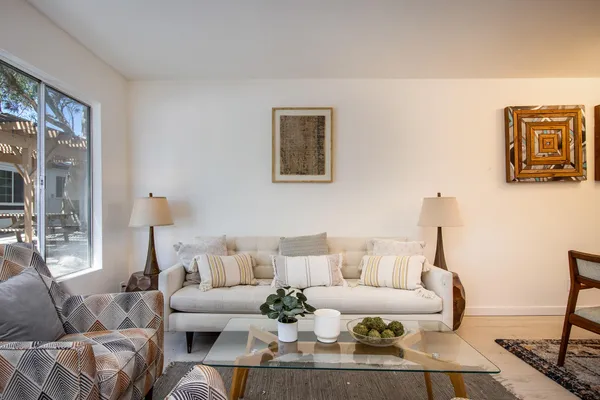 a living room with furniture and a large window