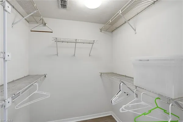 a view of storage and utility room with racks on the wall