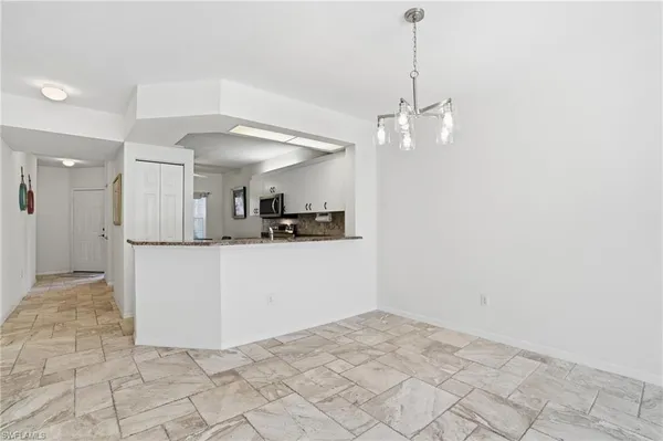 a view of a kitchen with a sink