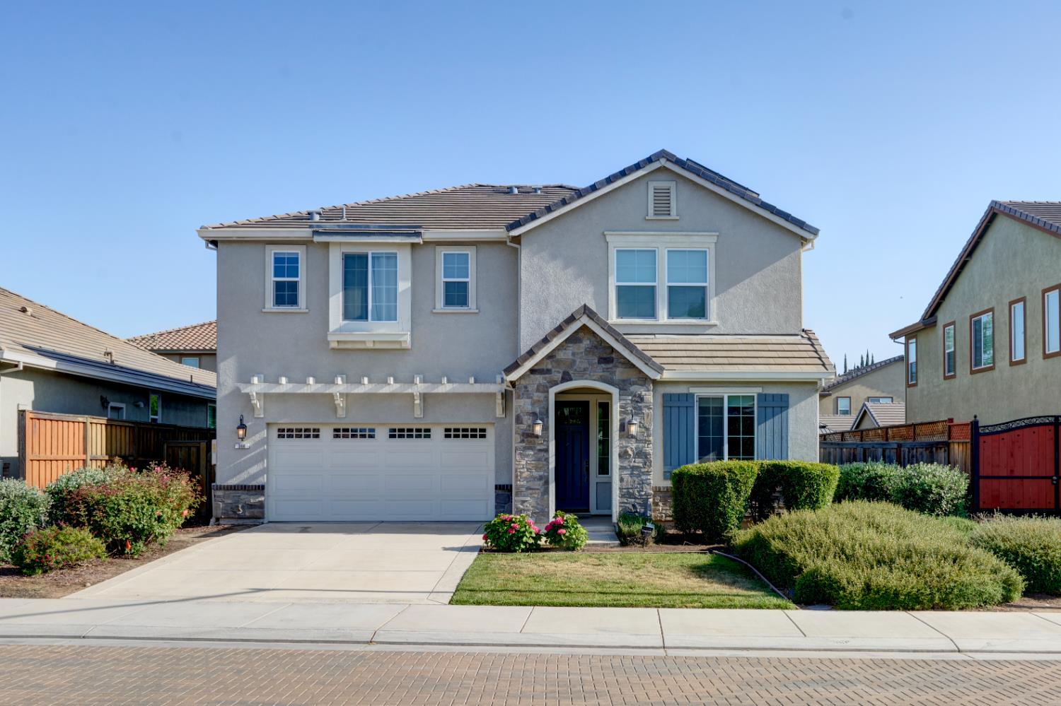 366 Franklin Lane Ripon, CA 95366 - Photo 1 of 1 a front view of a house with a yard and garage