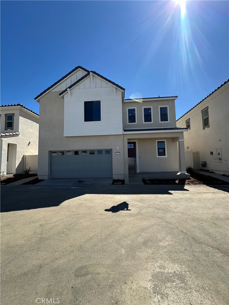 a front view of a house with parking