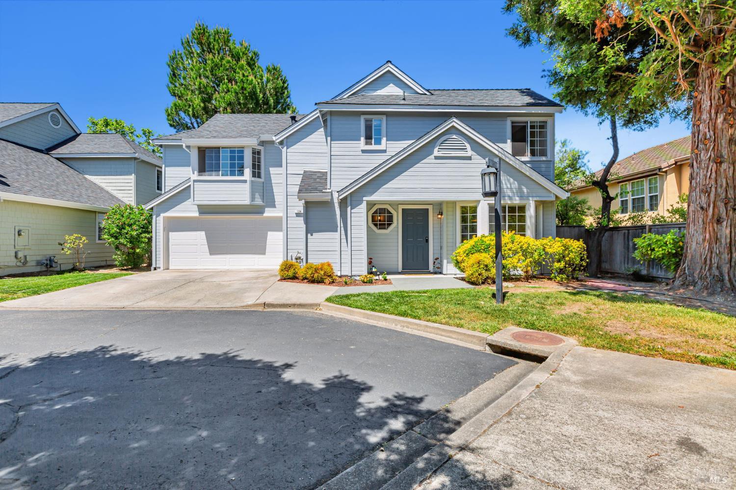 124 Ignacio Valley Circle Novato, CA 94949 - Photo 1 of 1 a front view of a house with a yard and garage