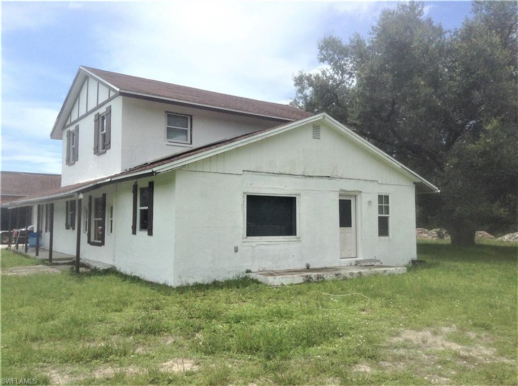 2781 Cecil Road Naples, FL 34114 - Photo 3 of 18 Side view of north side of home