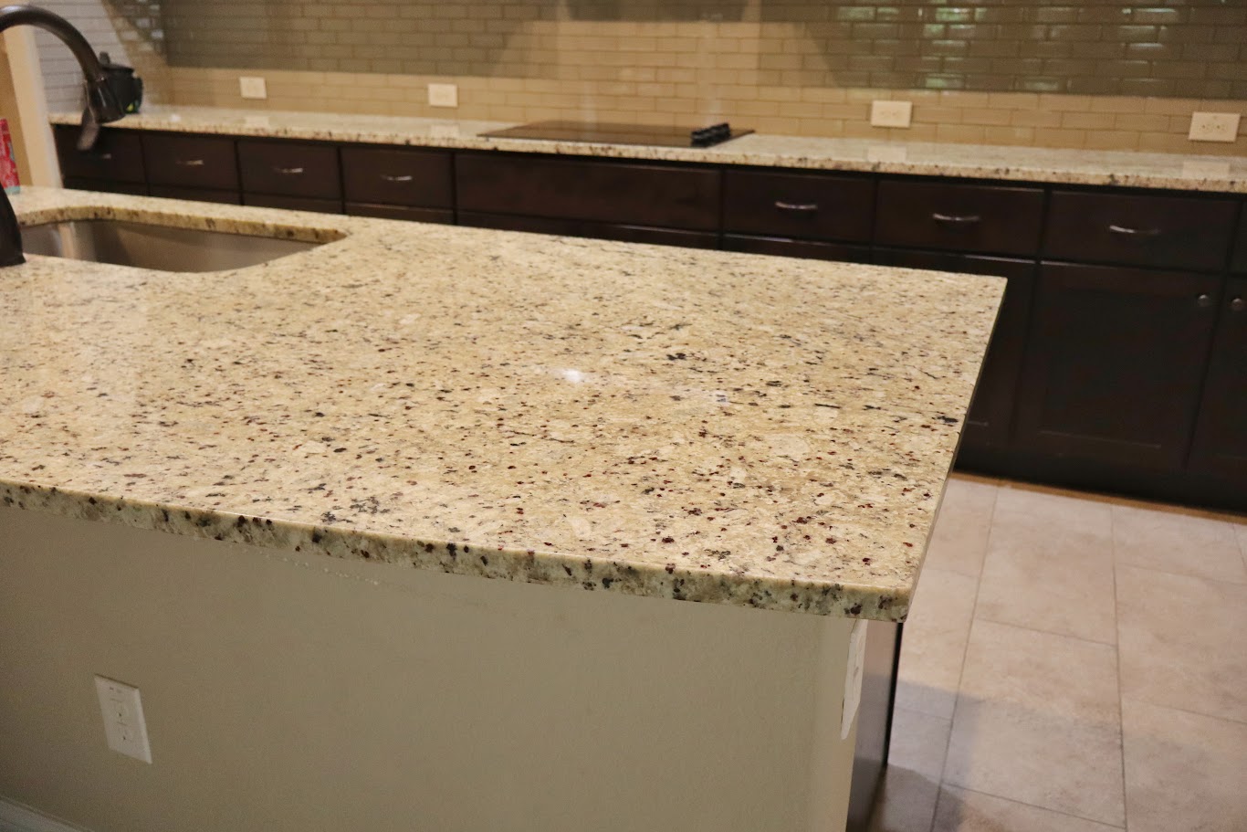 1509 Highland Ridge Road Georgetown, TX 78628 - Photo 25 of 28 Granite counters and dark wood cabinetry define this well-appointed culinary space.